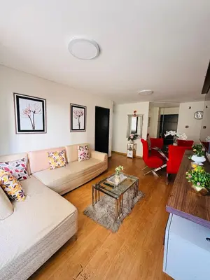 a living room with a couch and a table at Departamento AltoVerde - Pueblo Libre in Lima