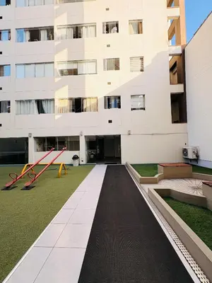 an external view of a building with a garden at Departamento AltoVerde - Pueblo Libre in Lima