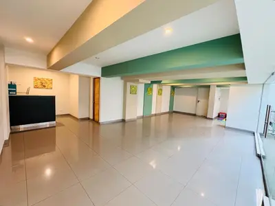 a large empty room with a flat screen tv at Departamento AltoVerde - Pueblo Libre in Lima