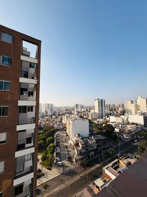 a view of a city with a tall building at Departamento AltoVerde - Pueblo Libre in Lima