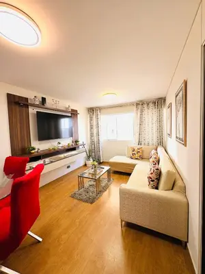 a living room with a couch and a tv at Departamento AltoVerde - Pueblo Libre in Lima