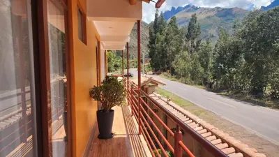 a balcony with a view of a mountain road at Chakana Wasi in Calca
