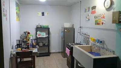 a kitchen with a stove and a refrigerator at 4th Youth Loft Private Open Terrace Close Beach in Lima