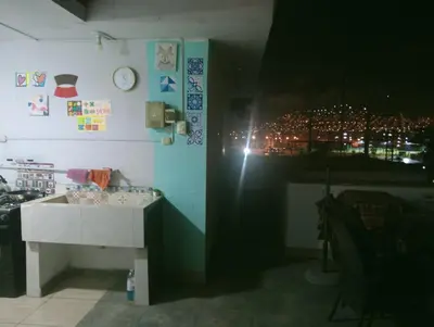 a bathroom with a sink and a view of a city at 4th Youth Loft Private Open Terrace Close Beach in Lima