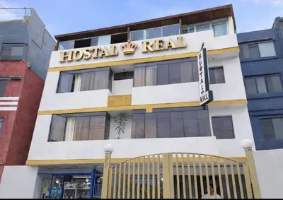 a building with a hospital real sign on it at Hostal Real in Lima
