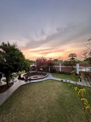 a view of a park with a fountain in a yard at La Fogata del Sur in Asia