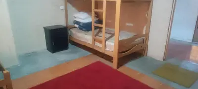 a room with a book shelf and a speaker at Cozy Rural House in Apata - Jauja
