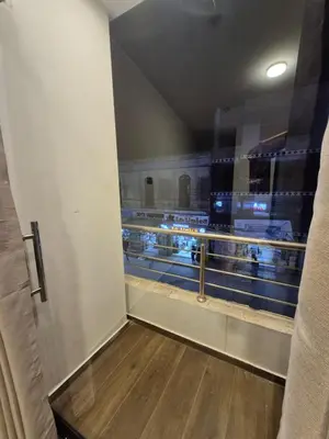 a hallway with a view of a baseball game at Hotel Zaniah in Huancayo