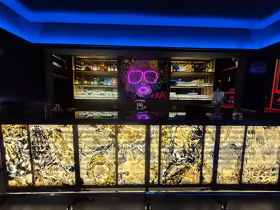 a bar with a mask and purple glasses at Hotel Zaniah in Huancayo