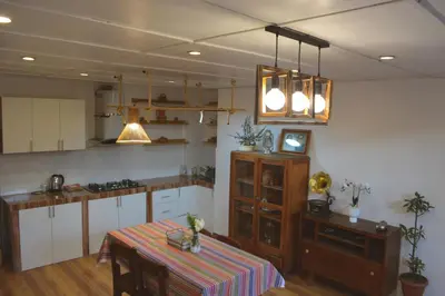 a kitchen with a table and a table sidx sidx sidx sidx at La Casa de Toño in Huancayo
