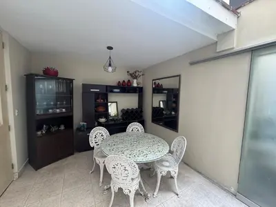 a dining room with a table and chairs at Comfortable apartment in downtown area - 3 bedrooms in Lima