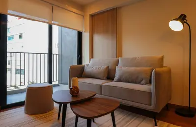 a living room with a couch and a table at Schell in Miraflores by Wynwood House in Lima