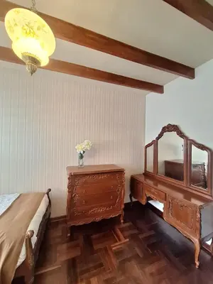 a bedroom with a bed and a dresser and a mirror at Historic Quinta, Heart of Miraflores, 2 Bedroom Apartment in Lima
