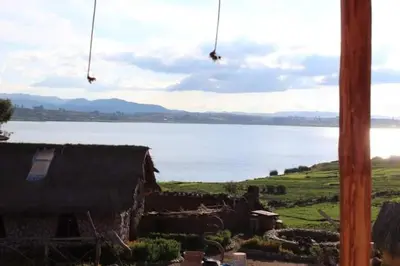 a view of a body of water from a house at Cabañas lago piuray in Chinchero