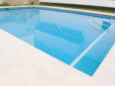 a swimming pool with a blue tile in it at Apartment with Beach Exit 203 in Punta Negra