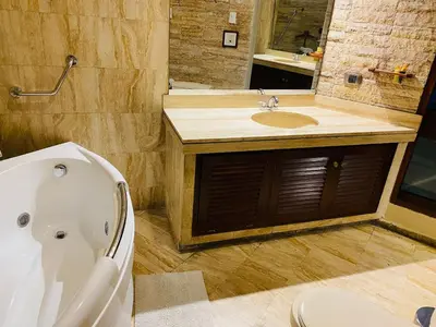 a bathroom with a tub and a sink and a toilet at Apto/ cama king2 en el centro Miraflores in Lima
