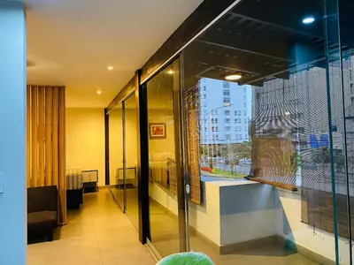 a room with a window with a view of a building at Tu Refugio en Miraflores – Céntrico y Tranquilo in Lima
