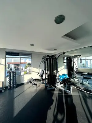 a gym with treadmills and machines in a room at Dpto entero 2 dormitorios 2 baños máximo 5 personas in Lima