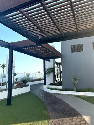 a patio with a wooden pergola on a house at Dpto entero 2 dormitorios 2 baños máximo 5 personas in Lima