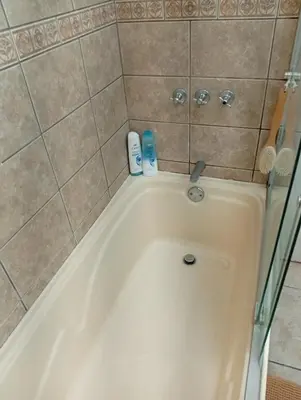 a bath tub with two products sitting on top of it at Large Oceanview Balcony Apartment in Miraflores in Lima