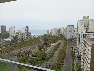 a view of a city street with tall buildings at Large Oceanview Balcony Apartment in Miraflores in Lima