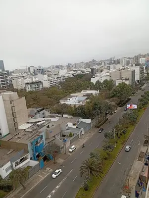an aerial view of a city with cars on a street at Large Oceanview Balcony Apartment in Miraflores in Lima