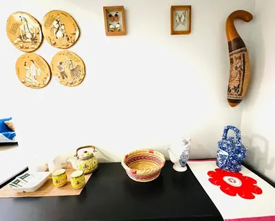 a table with bowls and plates on a wall at Apartamento San Borja in Lima