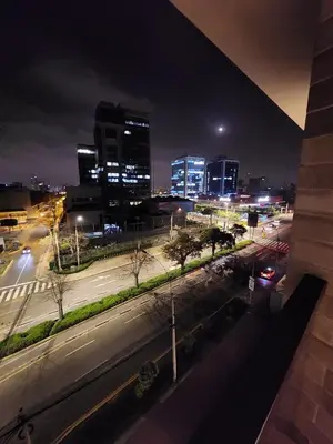 a view of a city at night with buildings at Elegante Departamento de Estreno en Centro Financiero in Lima