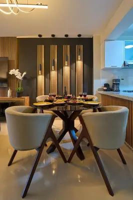 a dining room with a table and two chairs at Apartamento moderno cerca del Parque Wallenberg in Lima