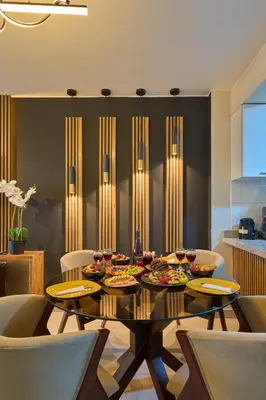 a dining room with a table with food on it at Apartamento moderno cerca del Parque Wallenberg in Lima