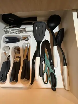 a drawer filled with lots of utensils at Apartment in Victoria in Lima