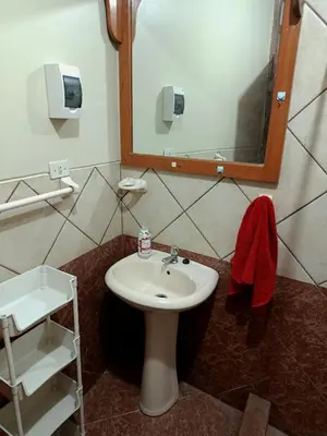 a bathroom with a sink and a mirror at bambanhouse in Cusco
