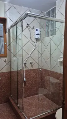 a shower with a glass enclosure in a bathroom at bambanhouse in Cusco