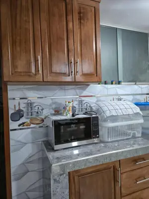 a kitchen with a microwave on a counter at Camino del Sol in Cusco