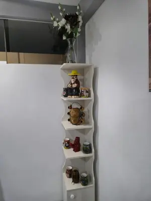 a white shelf with toys in a refrigerator at Camino del Sol in Cusco