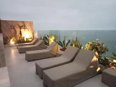 a group of couches sitting on top of a building at Edificio The sight Barranco vista al mar in Lima