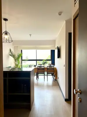 a kitchen and dining room with a dining table at Beautiful Modern Apartment in Lima in Lima
