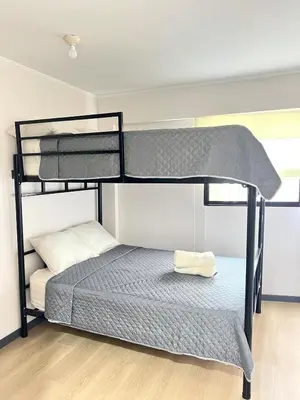 a bedroom with a bunk bed in a room at Beautiful Modern Apartment in Lima in Lima
