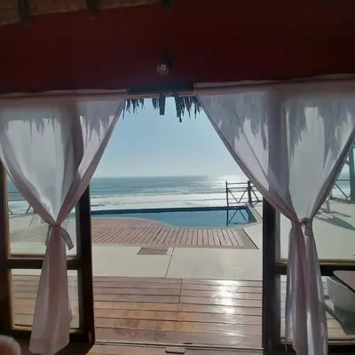 a view of the ocean from a room with a window at Linda Casa de playa con vista al mar de Wakama in Jaguay