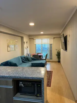 a living room with a couch and a table at Magical View Parque de las Aguas, central apartment in Lima