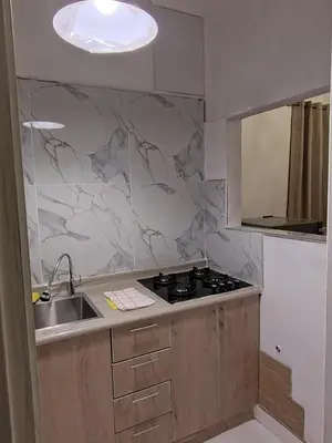 a kitchen with a sink and a stove at Centro Historico Lima - Apartamento in Lima