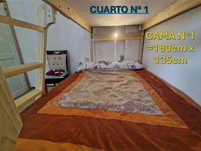 a bedroom with a large bed in a room at Centro Historico Lima - Apartamento in Lima