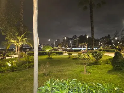 a park at night with a city in the background at Barranco sea in Lima