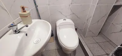 a bathroom with a white toilet and a sink at Vistas increíbles desde San Blas 4 in Cusco