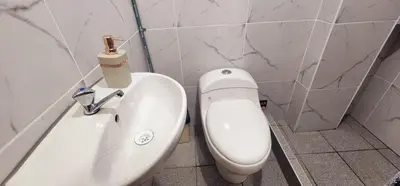 a bathroom with a toilet and a sink at Vistas increíbles desde San Blas 4 in Cusco