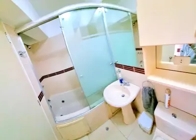 a small bathroom with a shower and a sink at E Tourist Zone Wifi Pro 2 Smart TV 3B 1206 in Lima