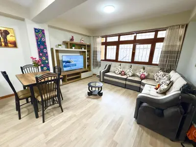 a living room with a couch and a table at Aitanas House Huancaro in Cusco
