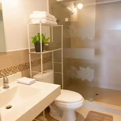 a bathroom with a toilet and a sink at E24h Modern Executive Loft 2BR 1401 in Lima
