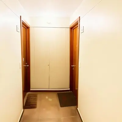 an empty corridor with doors and a tiled floor at E Green View Parking Wifi Pro 4B 904 in Lima