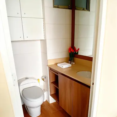 a bathroom with a toilet and a sink at E Green View Parking Wifi Pro 4B 904 in Lima